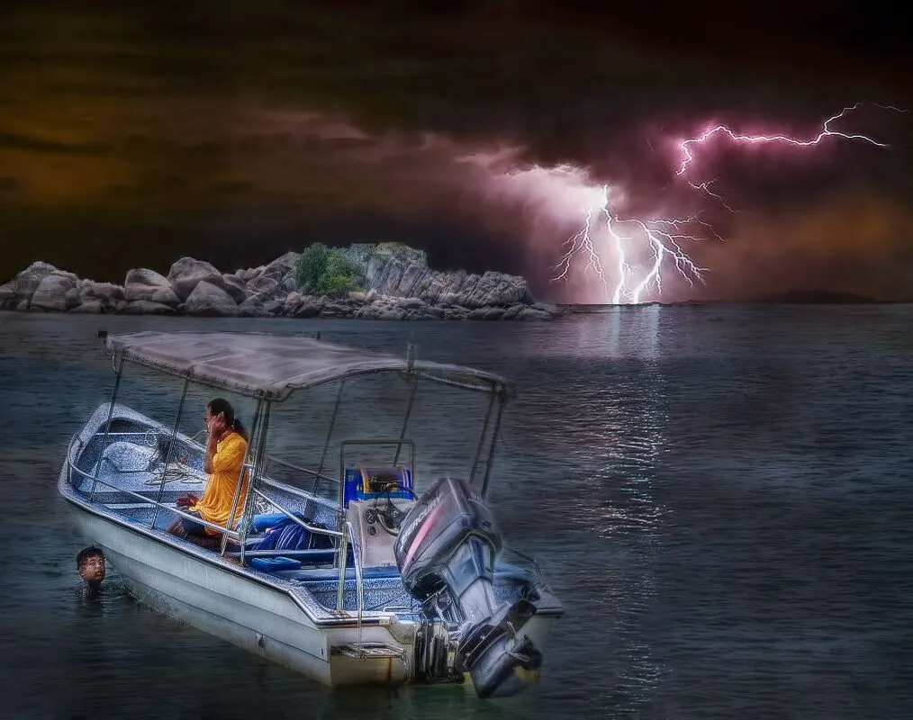 Small boat sailing in the sea with a lightning strike.