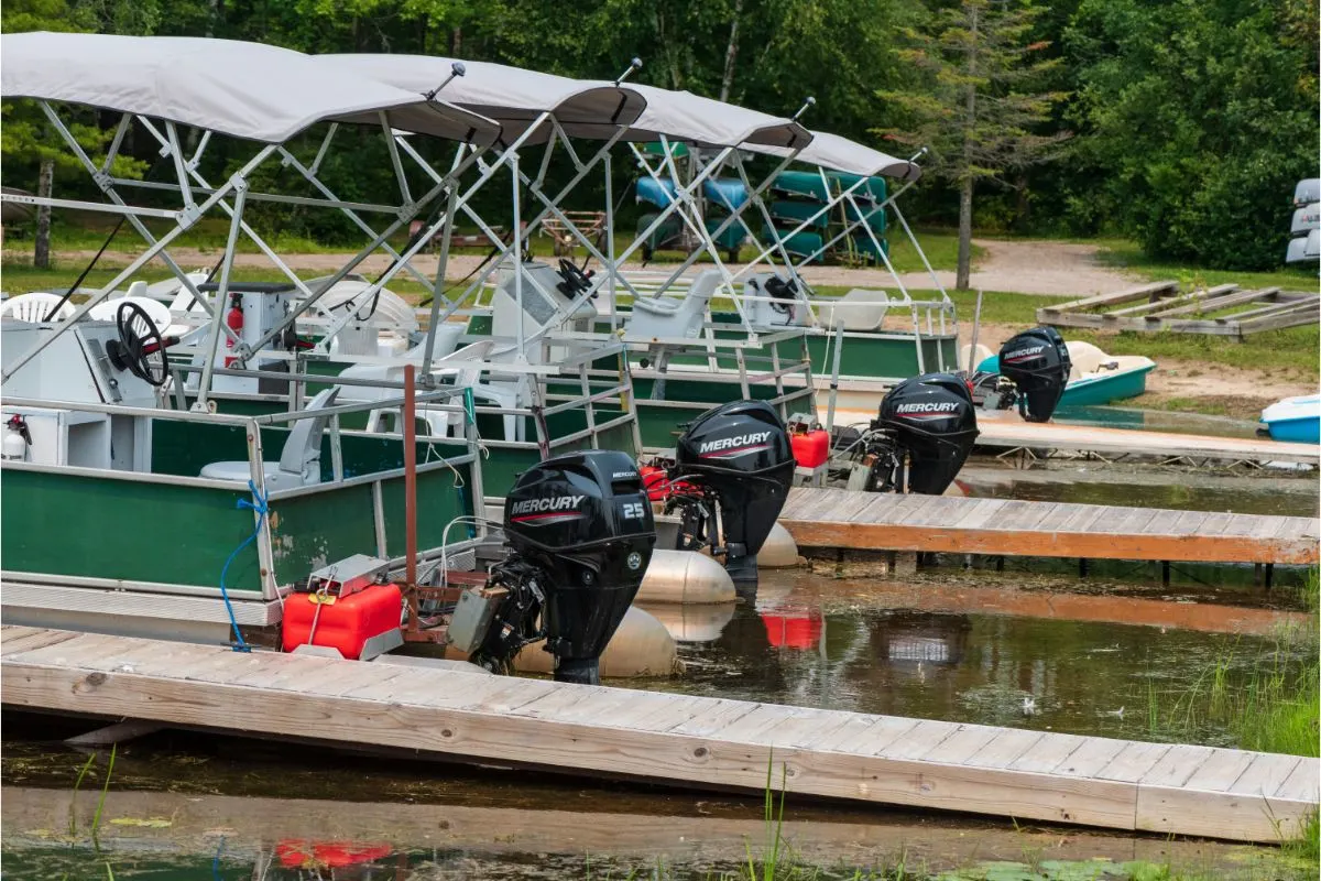 Boat being storaged in the water waiting to be used.