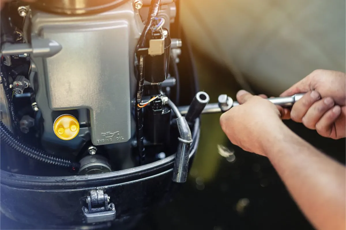 Man checking his boat engine for good running conditions.