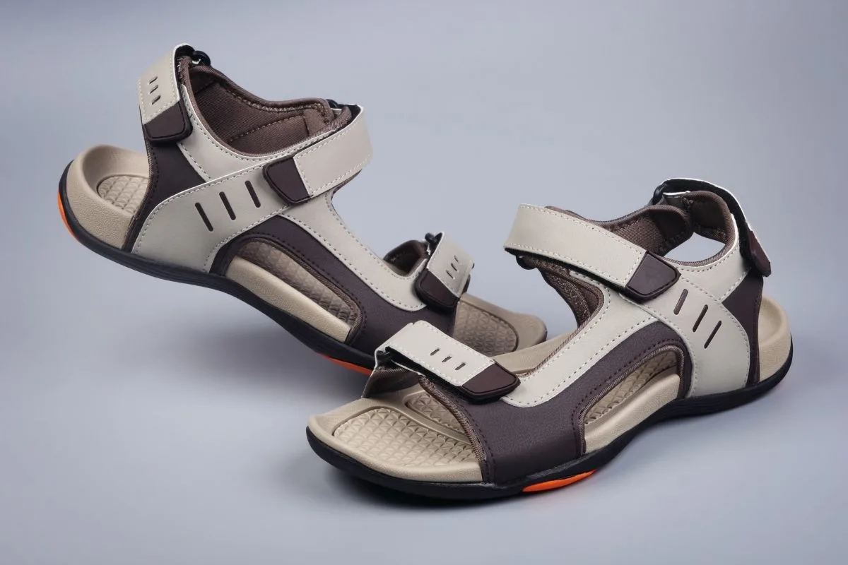 A pair of sandal on a gray background.