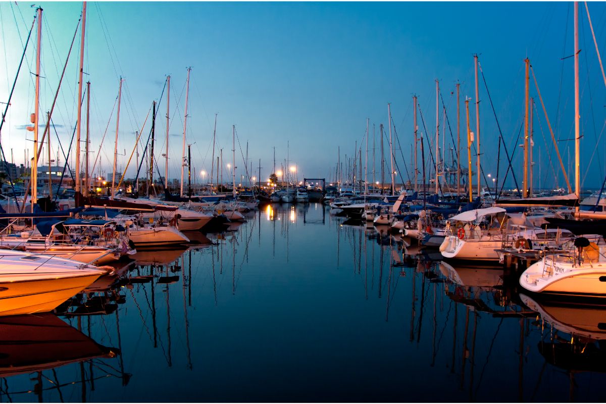 Night time view at the harbor with parked yachts.