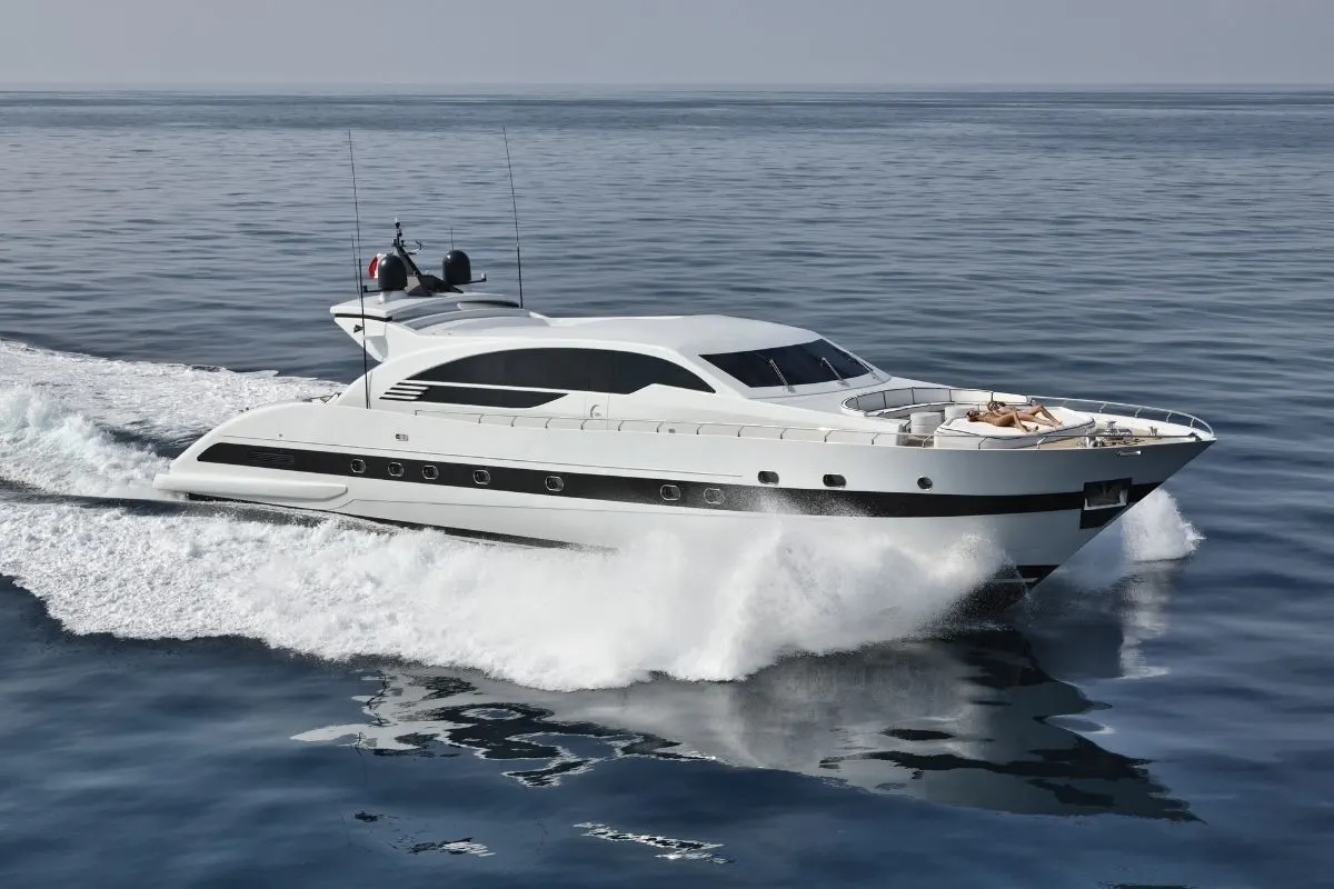 A white yacht sailing on the sea.