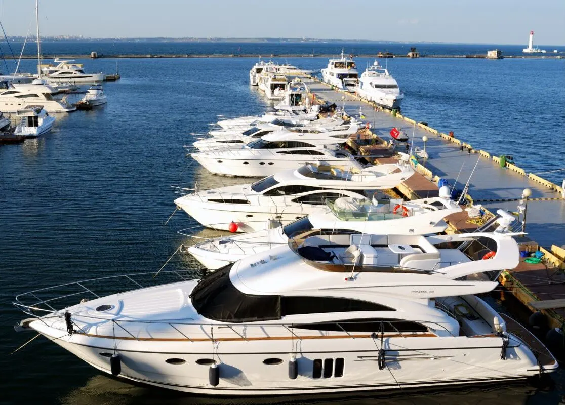 White yachts and modern motor boats at the harbor.