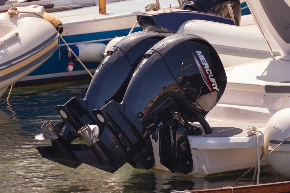 Two black electric boat motor parked in a dock in Nipales Italy.