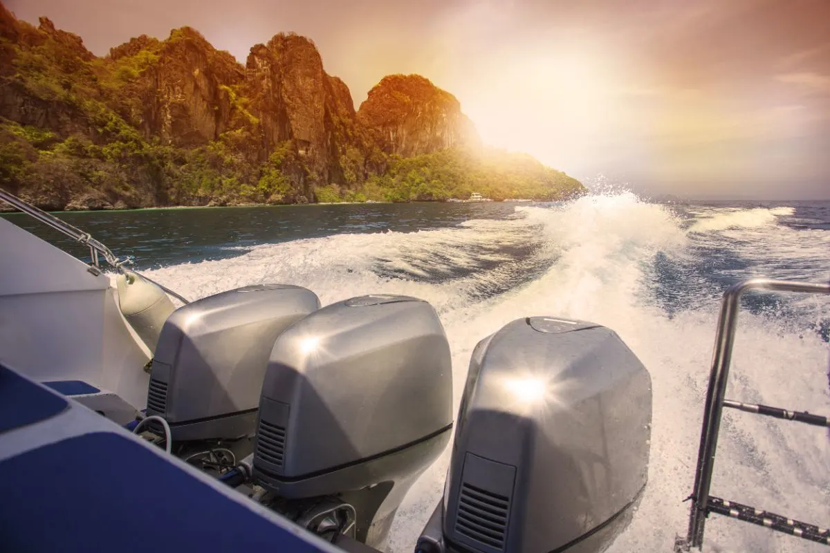 A photo of trace motor boats on the water of a ocean.