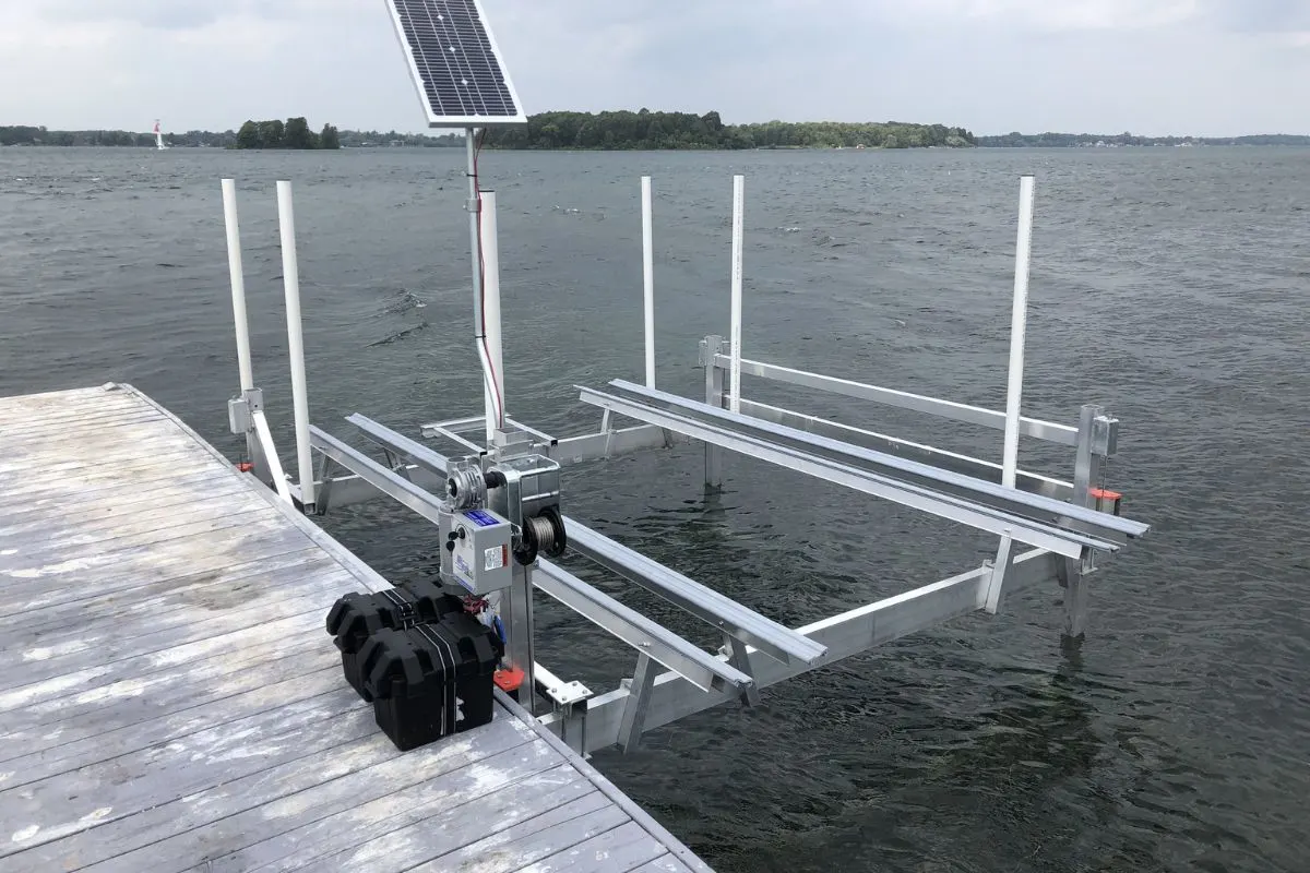 A photo of pontoon lifts with solar on the river.