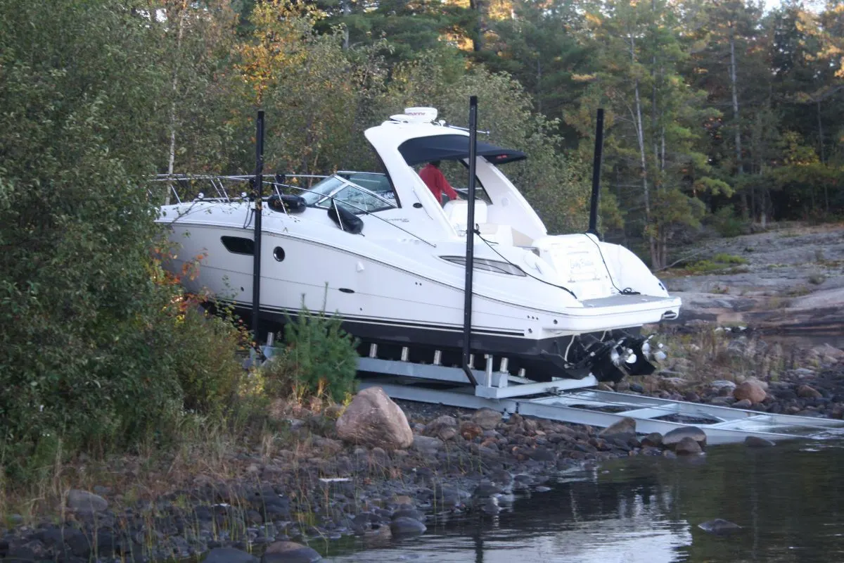 A boat being transferred to a dry boat storage boat marine railway system.