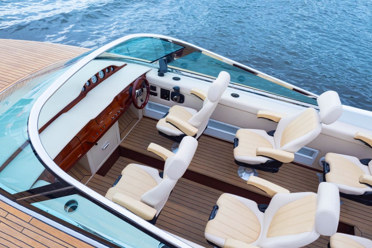 Luxurious pontoon boat with 4 boat seats in the cockpit area.