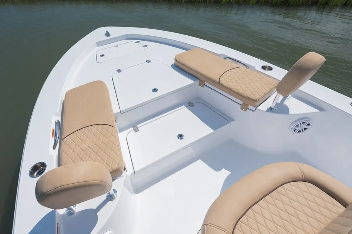 Zoom in angel of two cooler cushion and back rest seats in the front of a yacht.