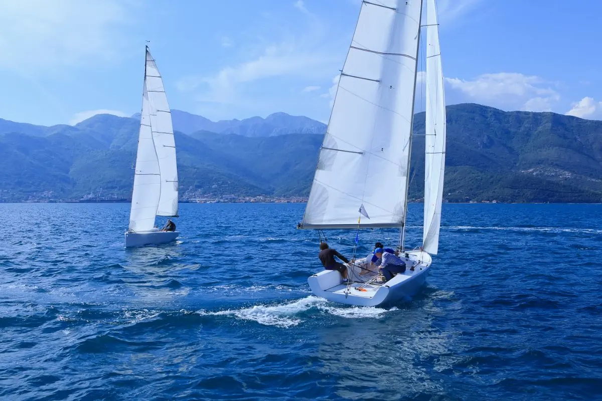 Two boats in one picture match racing sailing.