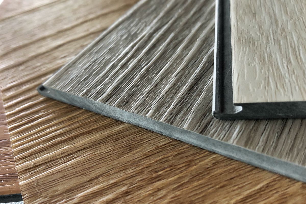 CLose up look of on structure detail of luxury wooden pattern vinyl floor tile.