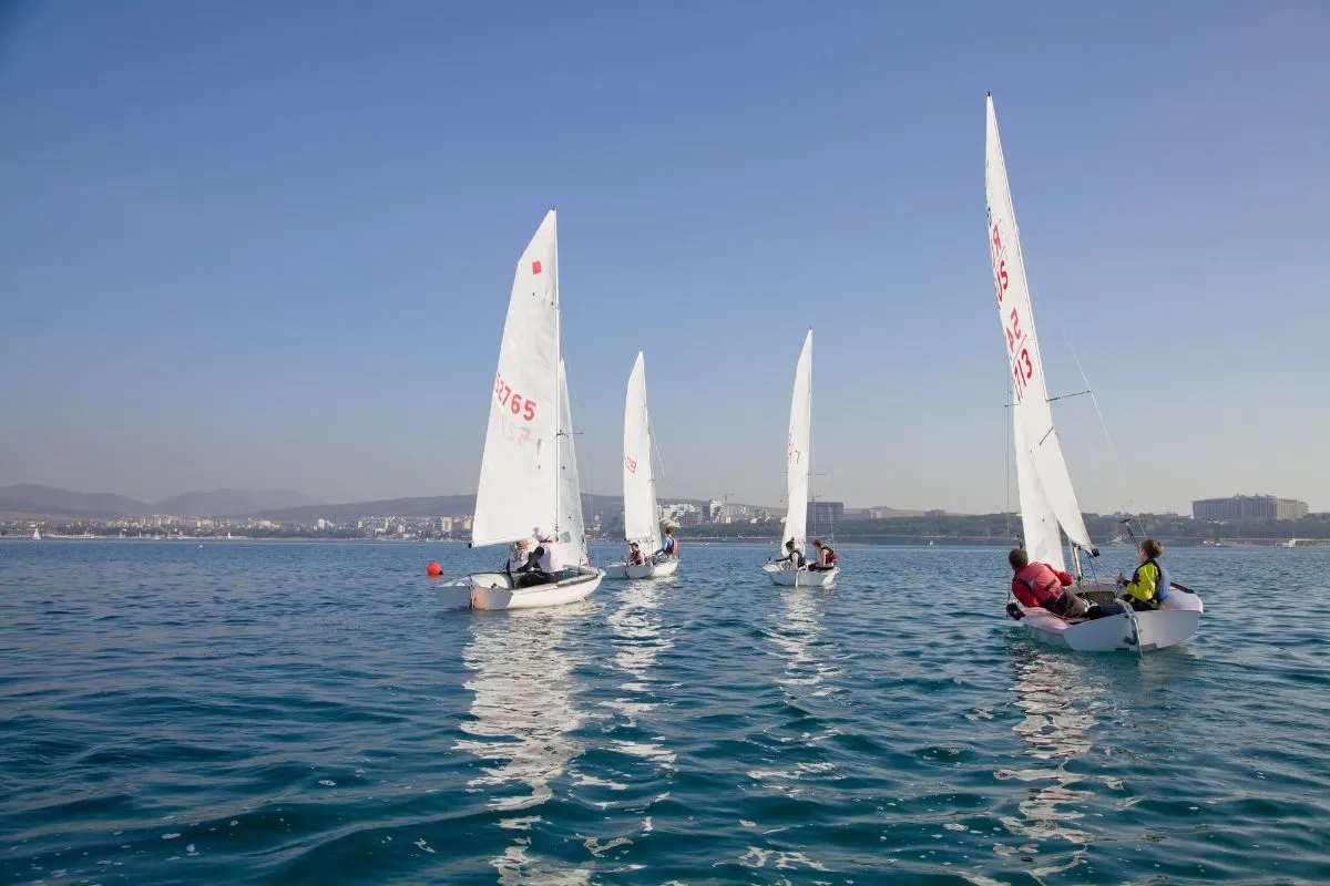 A photo of boats on the ocean for a competetion boat racing.