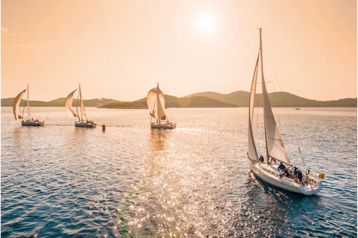 A beautiful scenery of four sailing boats windward racing.