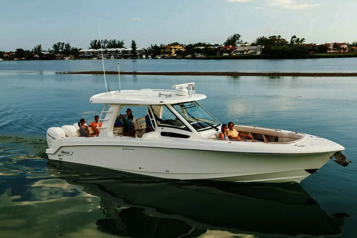 A group of friends on a vacation with their 2020 model Boston Whaler 350 Realm.