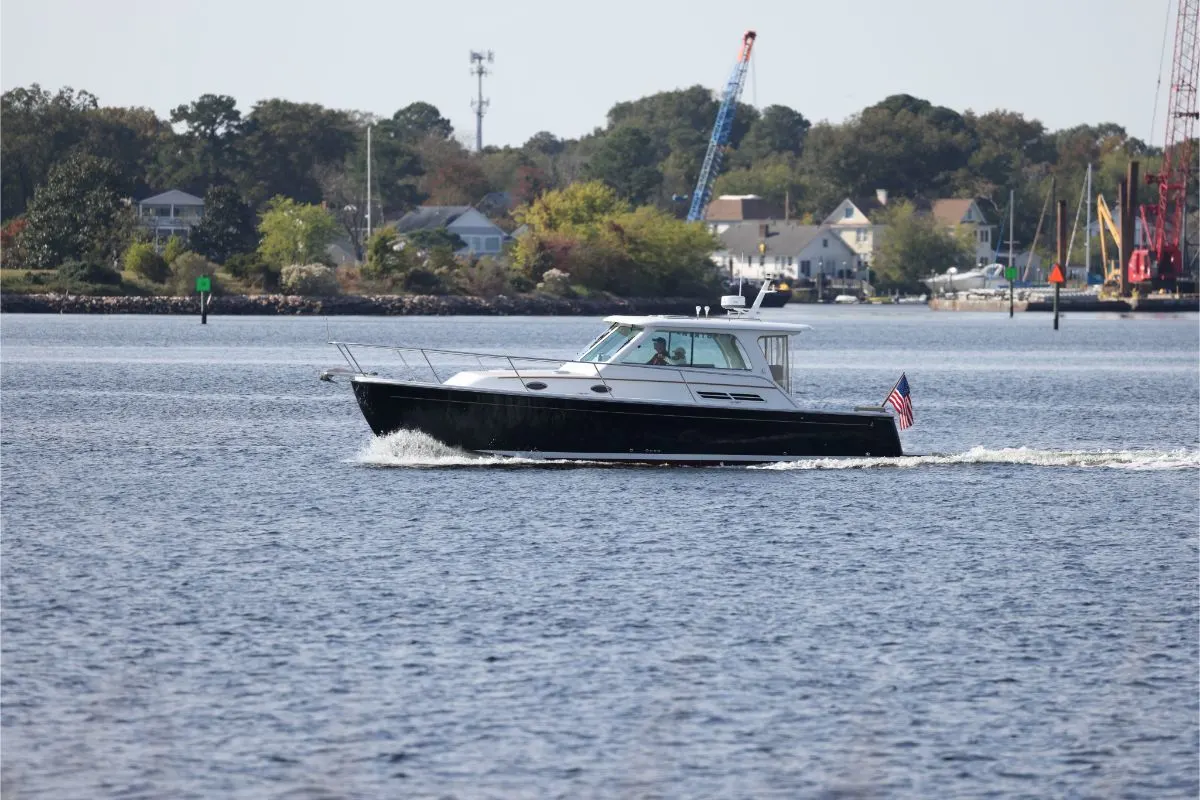 A Back Cove 32 motor yacht sailing in the Elizabeth river in the North Virginia.