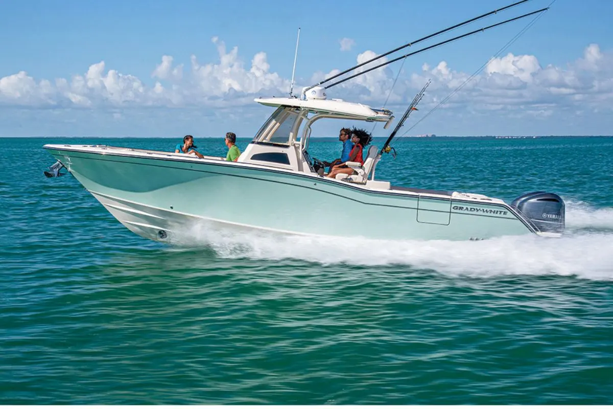 A family on vacation in the sea with their 2020 model Grady White Canyon on the sea.