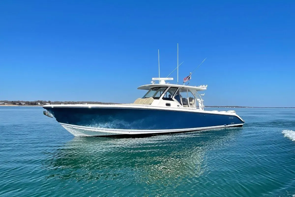 A pursuit S 408 Center Console yacht on the sea.