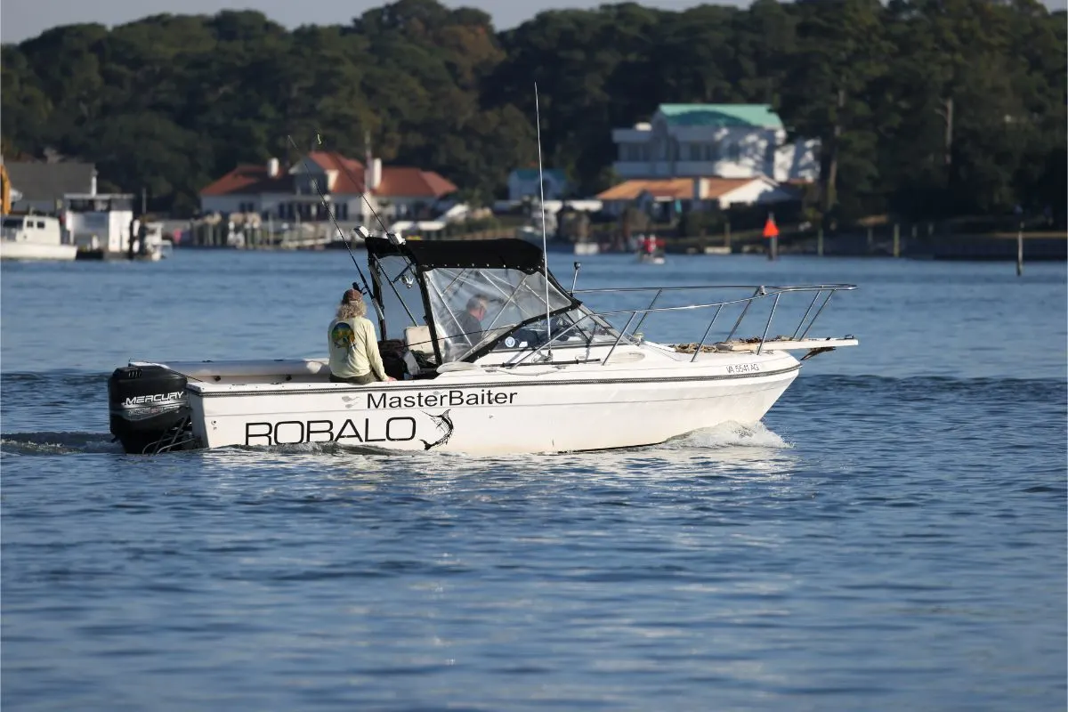 A fishermen on their Robalo R160 fishing boat ready to fish.