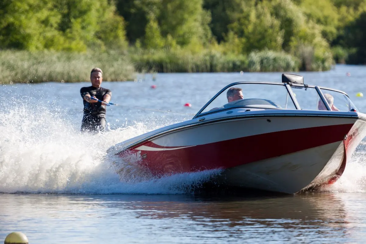 Two men water skiing at wiremill lake.