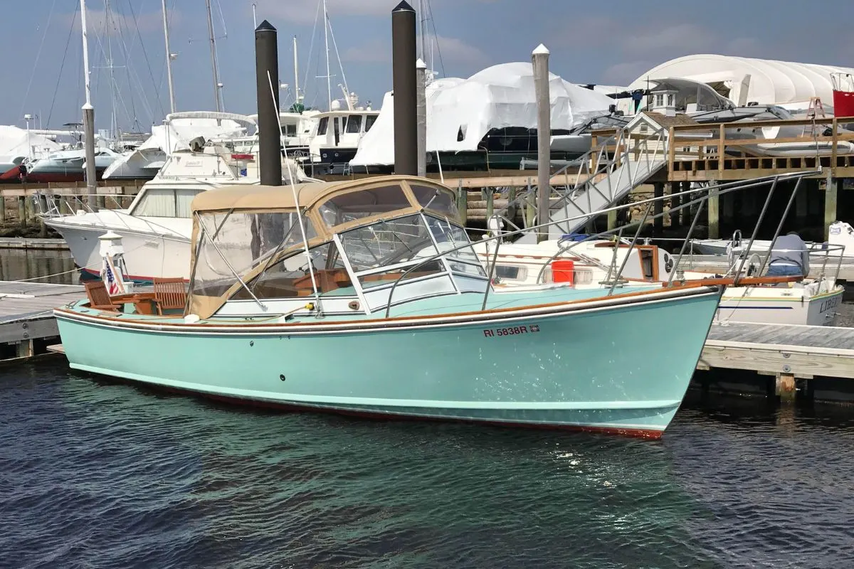 A vintage mint green colorway Dyer 29 spotter anchored in a dock.