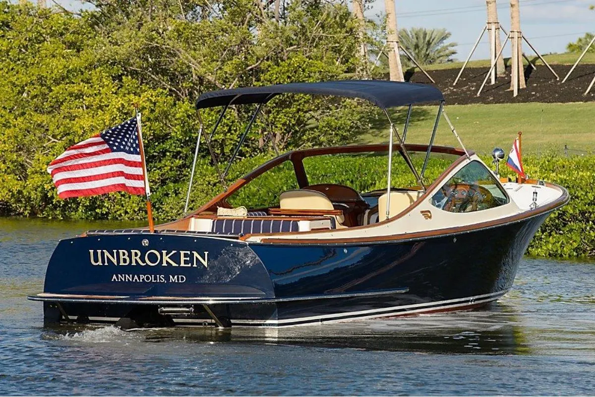 Back view of the Hinckley Talaria 29r called "Unbroken" anchored in a dock.