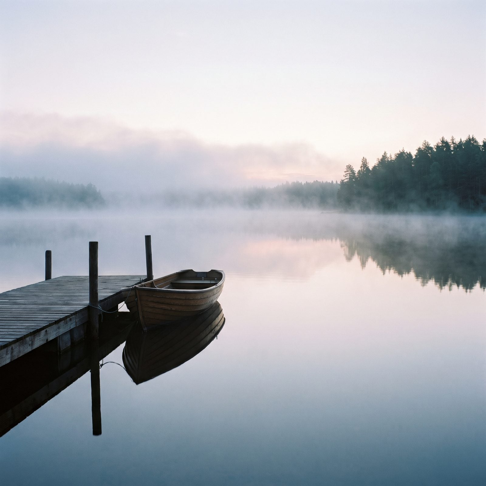 The Particular Hush Of Fog Sitting On Still Water
